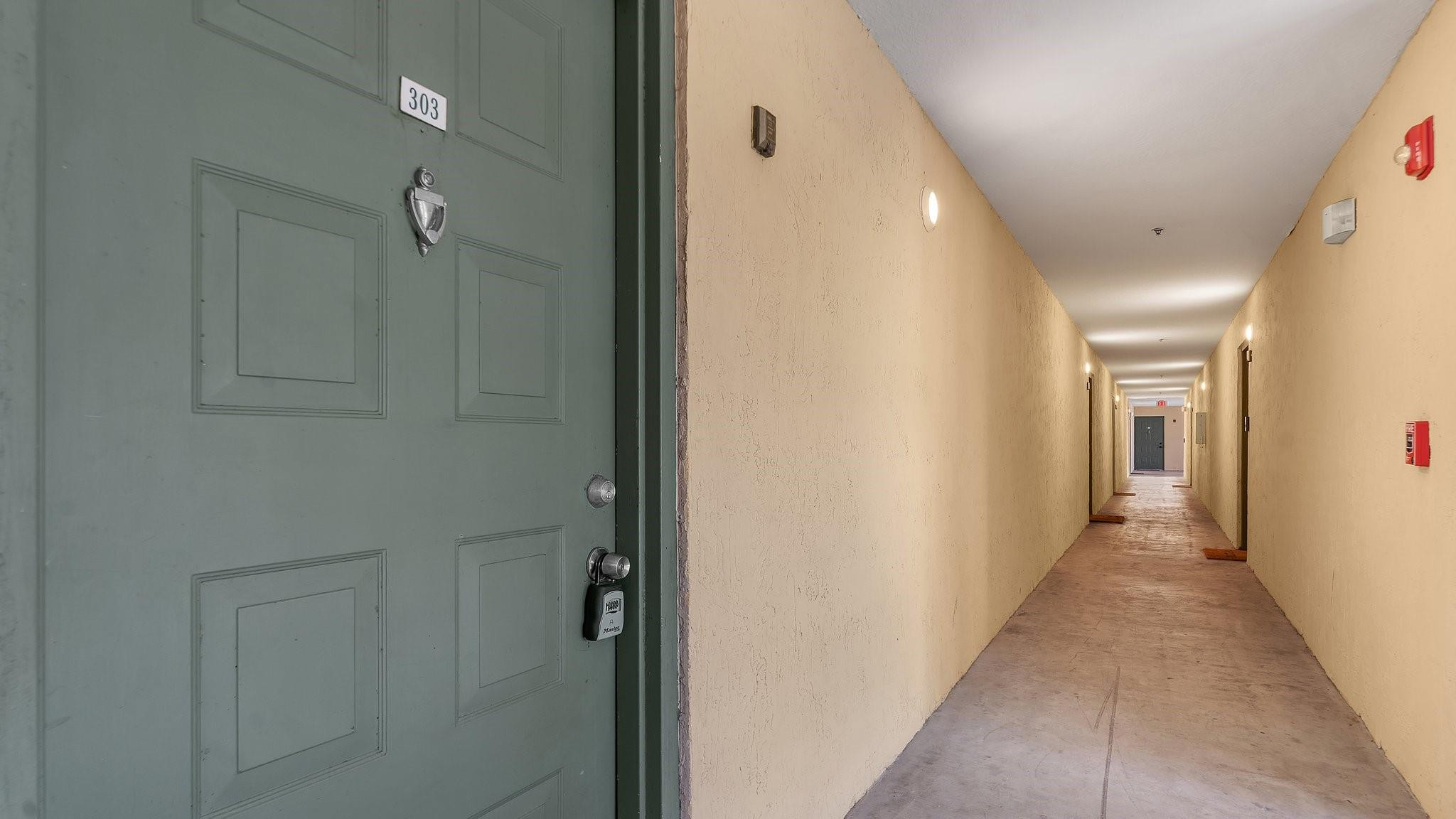 430 South Park Road, Unit 3303 Hollywood, FL 33021 - Photo 3 of 27 a view of a hallway with wooden floor