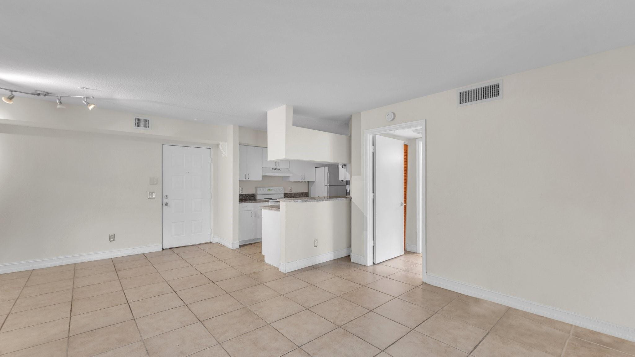 430 South Park Road, Unit 3303 Hollywood, FL 33021 - Photo 9 of 27 a view of a kitchen with white cabinets