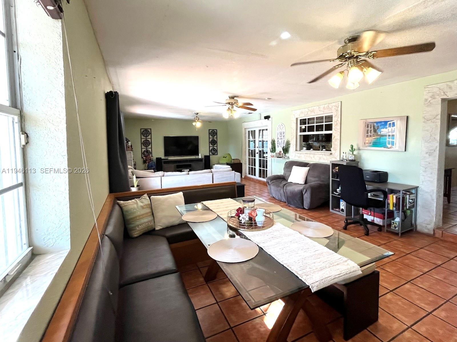16200 Southwest 284th Street Homestead, FL 33033 - Photo 11 of 23 a view of a dining room with furniture a fireplace and wooden floor