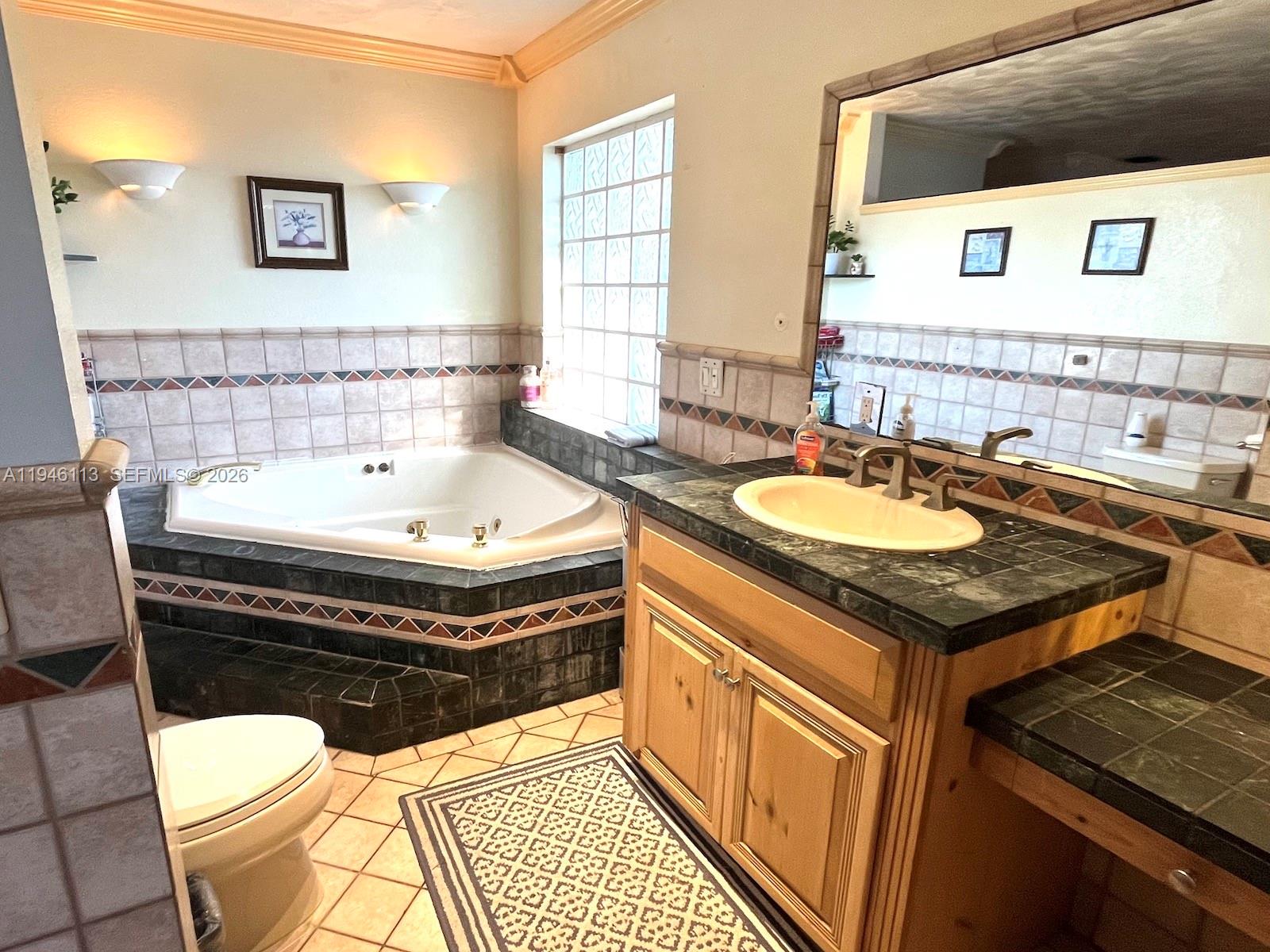 16200 Southwest 284th Street Homestead, FL 33033 - Photo 14 of 23 a bathroom with a sink and a bathtub
