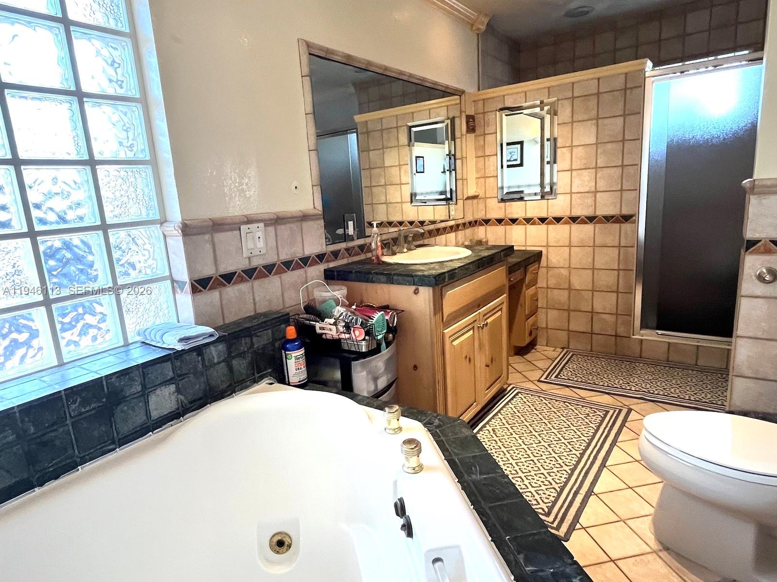 16200 Southwest 284th Street Homestead, FL 33033 - Photo 15 of 23 a bathroom with a sink a toilet and shower