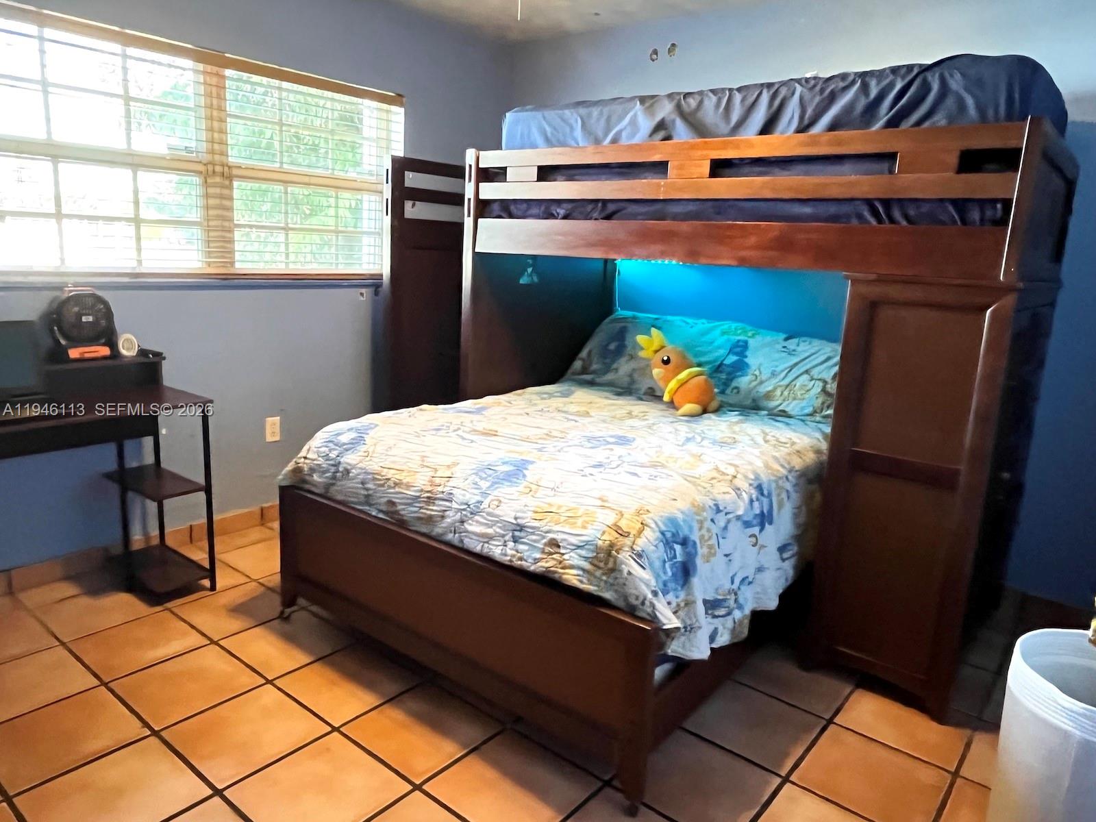 16200 Southwest 284th Street Homestead, FL 33033 - Photo 16 of 23 a bedroom with a bed and a window