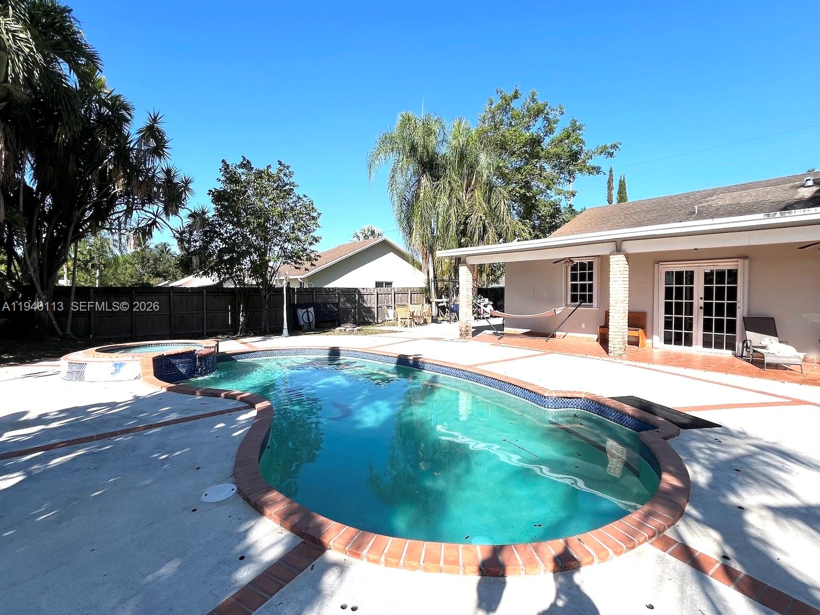 16200 Southwest 284th Street Homestead, FL 33033 - Photo 18 of 23 a swimming pool with outdoor seating and yard