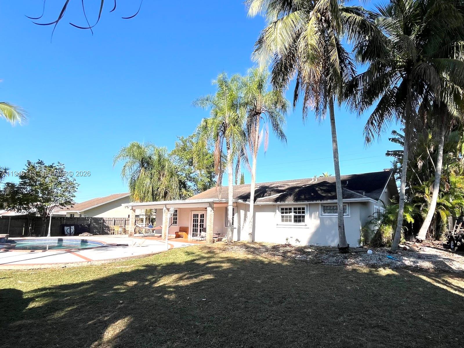 16200 Southwest 284th Street Homestead, FL 33033 - Photo 20 of 23 a front view of a house with garden