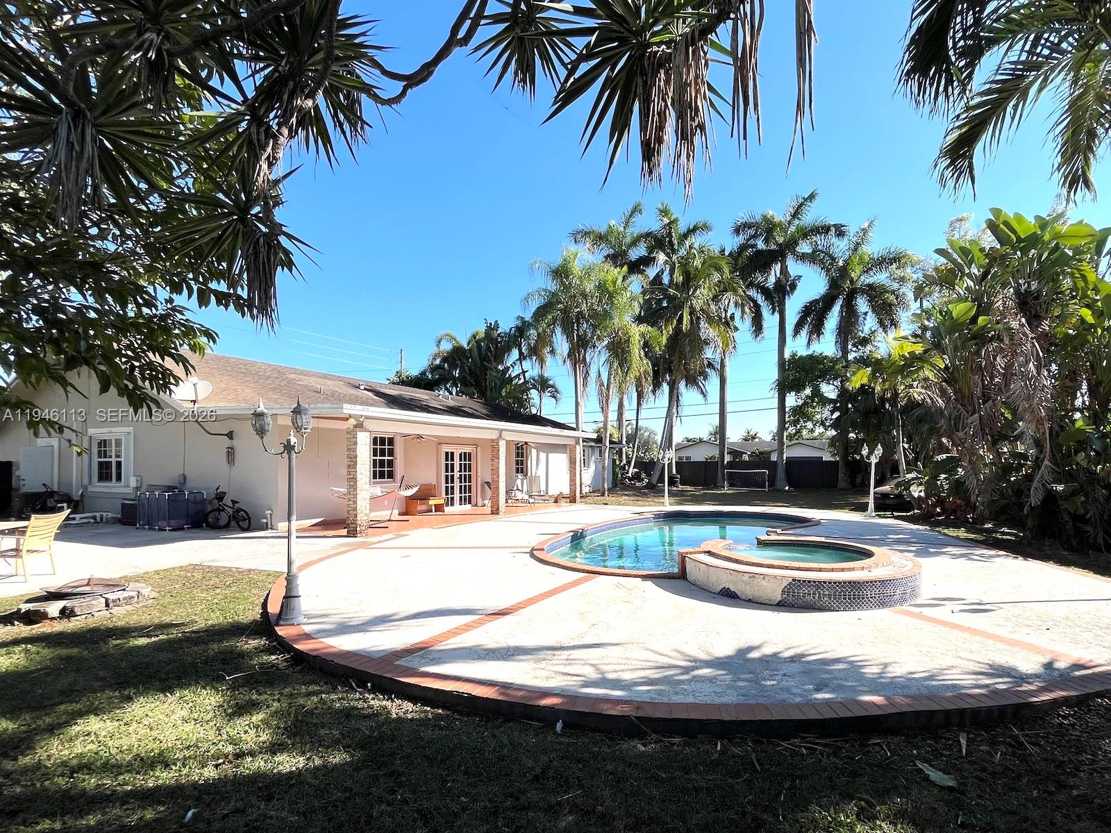 16200 Southwest 284th Street Homestead, FL 33033 - Photo 21 of 23 a view of a house with swimming pool and sitting area