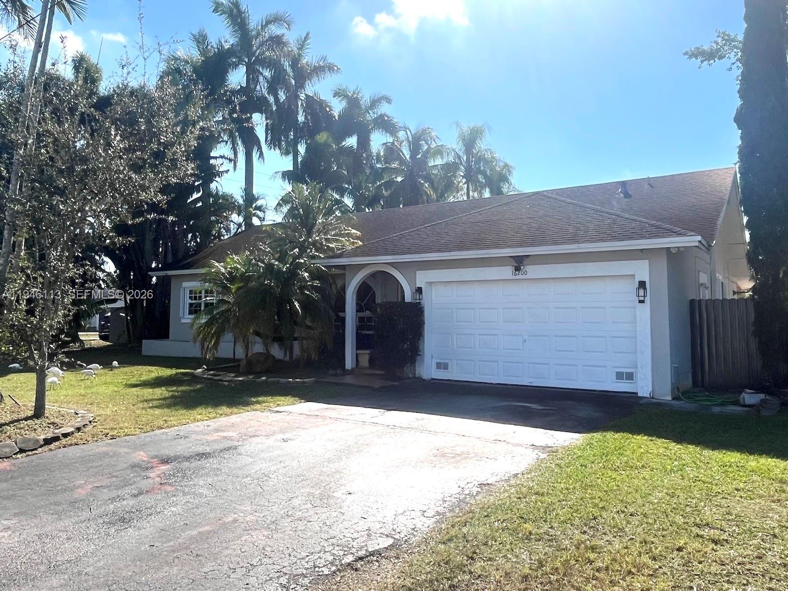 16200 Southwest 284th Street Homestead, FL 33033 - Photo 22 of 23 a view of a house with a yard covered with snow in front of house