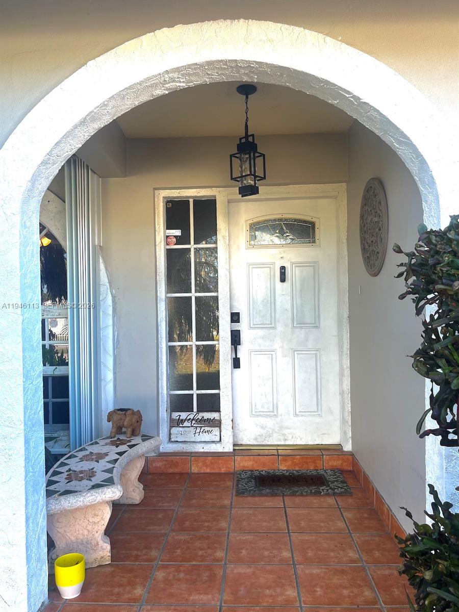 16200 Southwest 284th Street Homestead, FL 33033 - Photo 3 of 23 a front view of a house with a porch