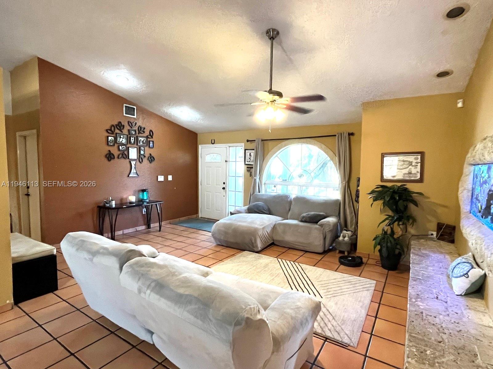 16200 Southwest 284th Street Homestead, FL 33033 - Photo 4 of 23 a bedroom with furniture and a large window