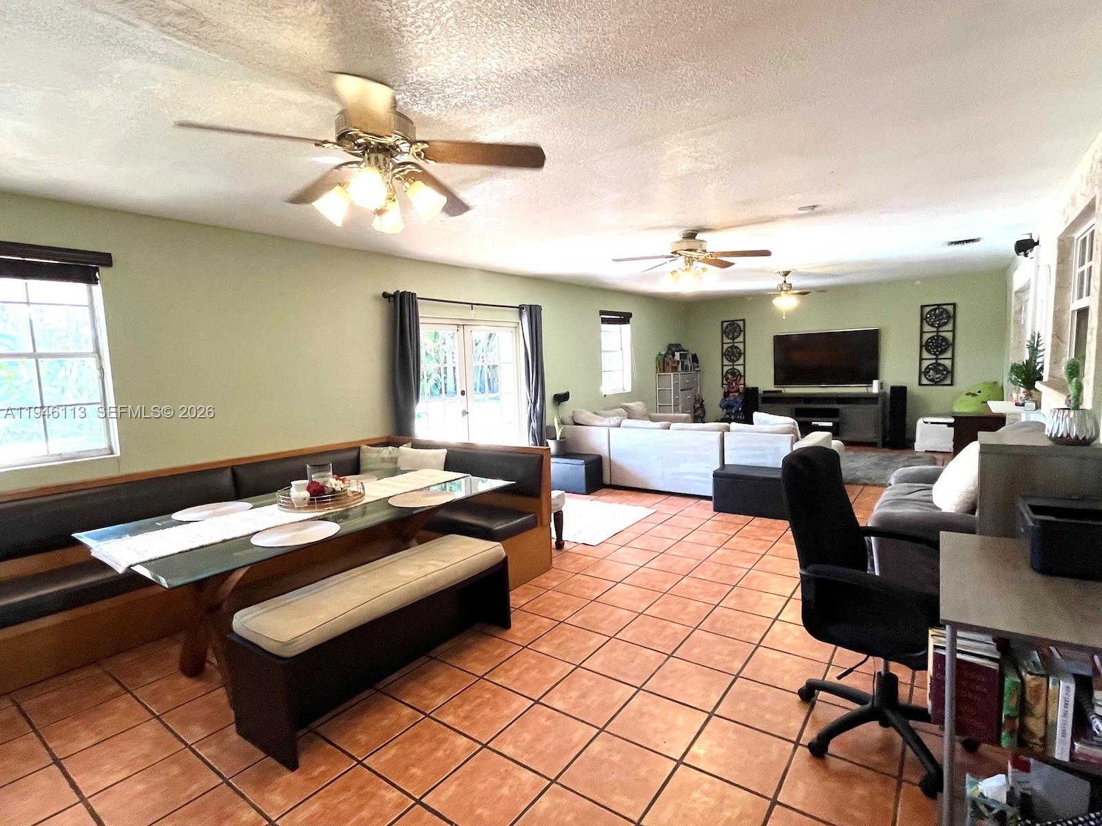 16200 Southwest 284th Street Homestead, FL 33033 - Photo 10 of 23 a living room with furniture and a flat screen tv