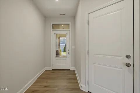 a kitchen with stainless steel appliances kitchen island a refrigerator sink and cabinets