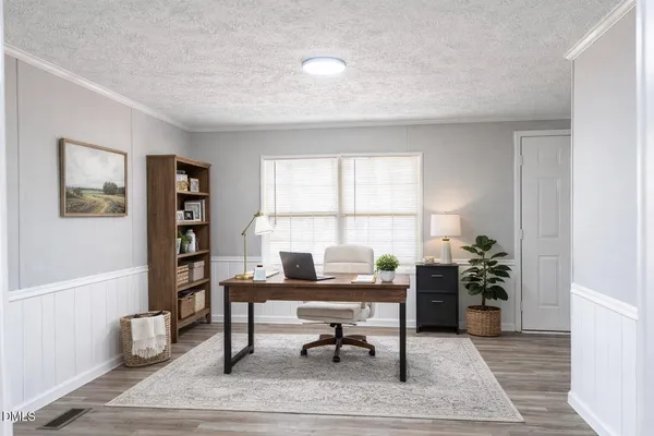 a workspace with furniture and window