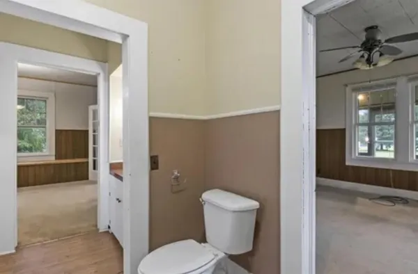 a bathroom with a toilet and a bathtub