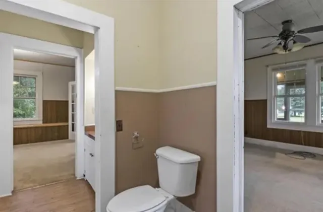 a bathroom with a toilet and a bathtub