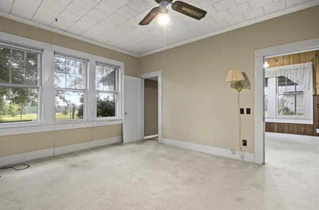 304 Daingerfield Street Naples, TX 75568 - Photo 21 of 25 a view of an empty room with a window