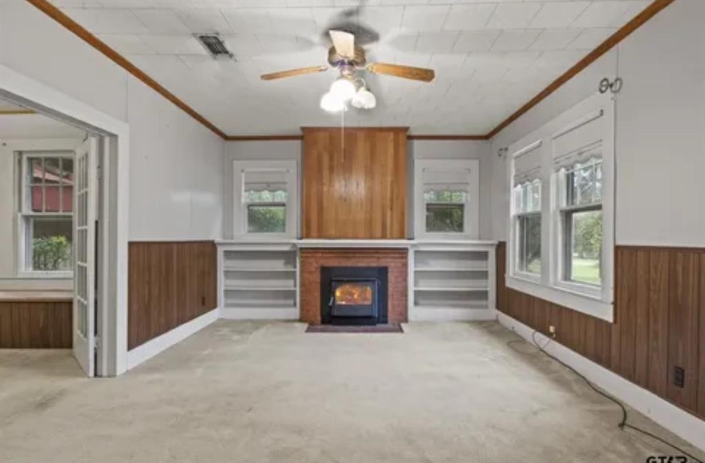 304 Daingerfield Street Naples, TX 75568 - Photo 7 of 25 a view of livingroom with furniture fireplace and window