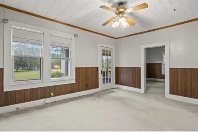 an empty room with closet and wooden floor