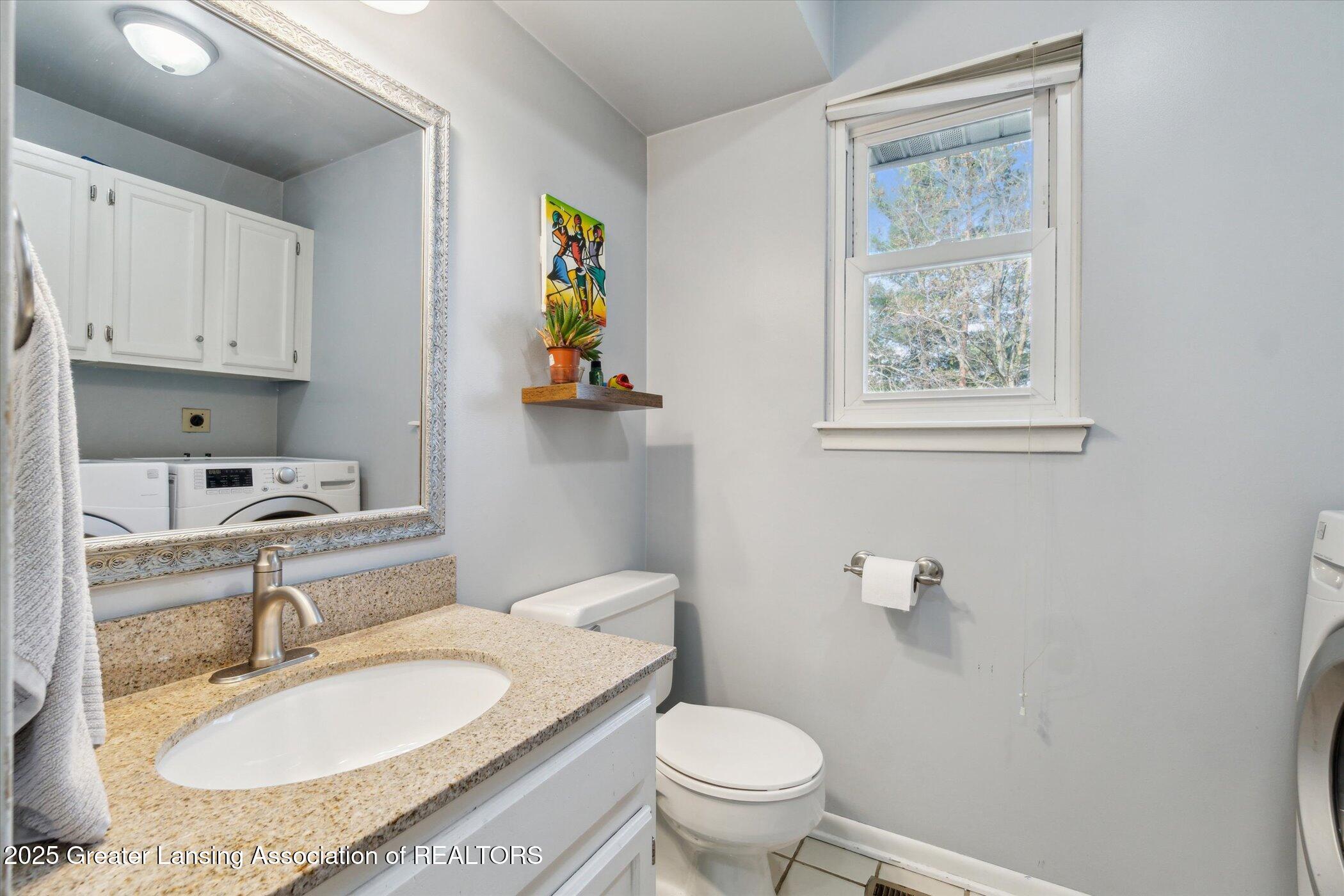 1310 Schavey Road Dewitt, MI 48820 - Photo 24 of 43 Half Bath / Laundry