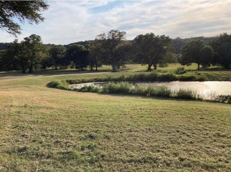 101 Private Road Aquilla, TX 76622 - Photo 19 of 19 View of green lawn featuring a water view