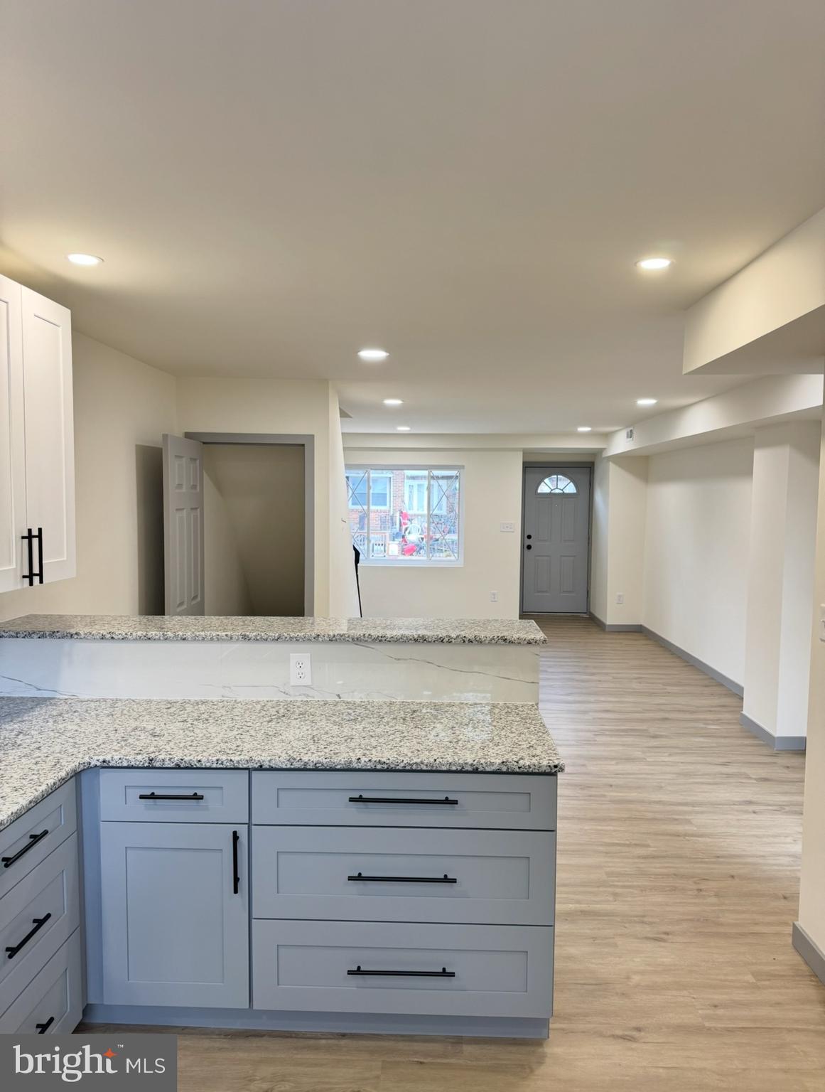 7816 Temple Road Philadelphia, PA 19150 - Photo 5 of 24 a view of kitchen island a sink and dishwasher with wooden floor