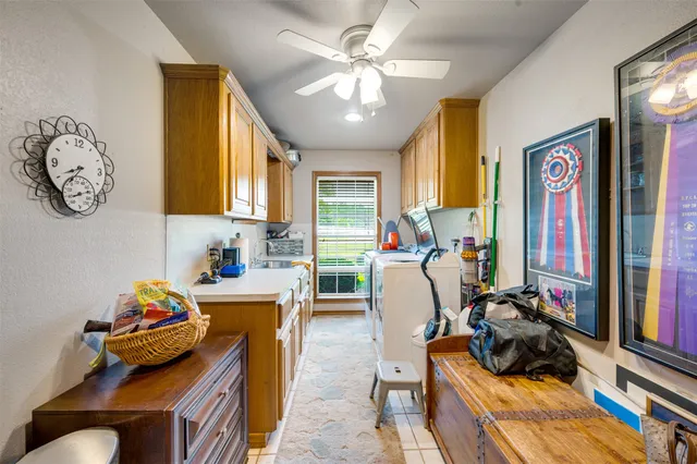 a living room with furniture a window and a flat screen tv