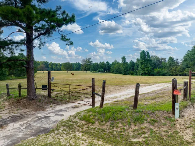 a view of park with wooden fence