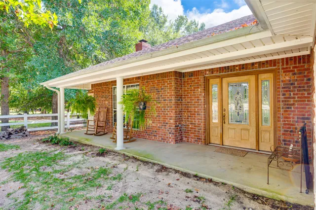a backyard of a house with outdoor seating