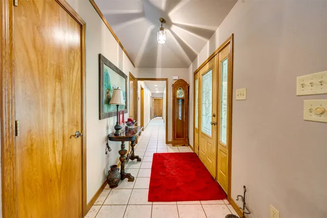 a very nice looking room with a mirror and a ceiling fan