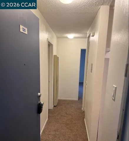 a white refrigerator freezer sitting inside of a kitchen