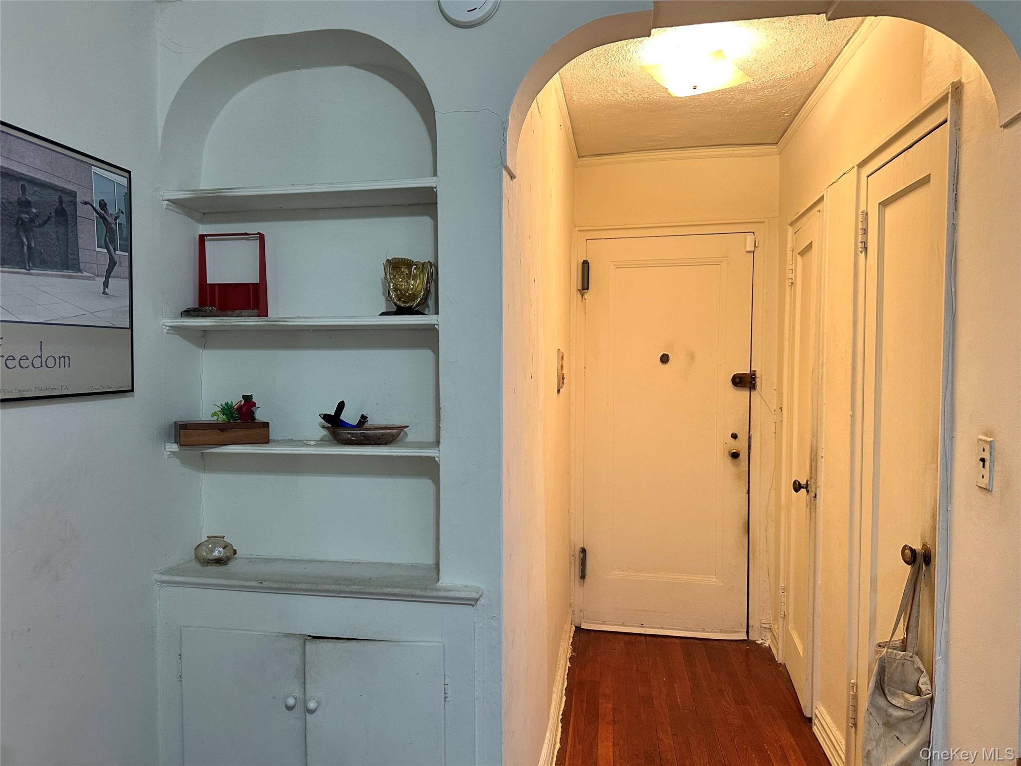 111-50 75th Road, Unit 1A Queens, NY 11375 - Photo 4 of 9 a view of storage and utility room with wooden floor