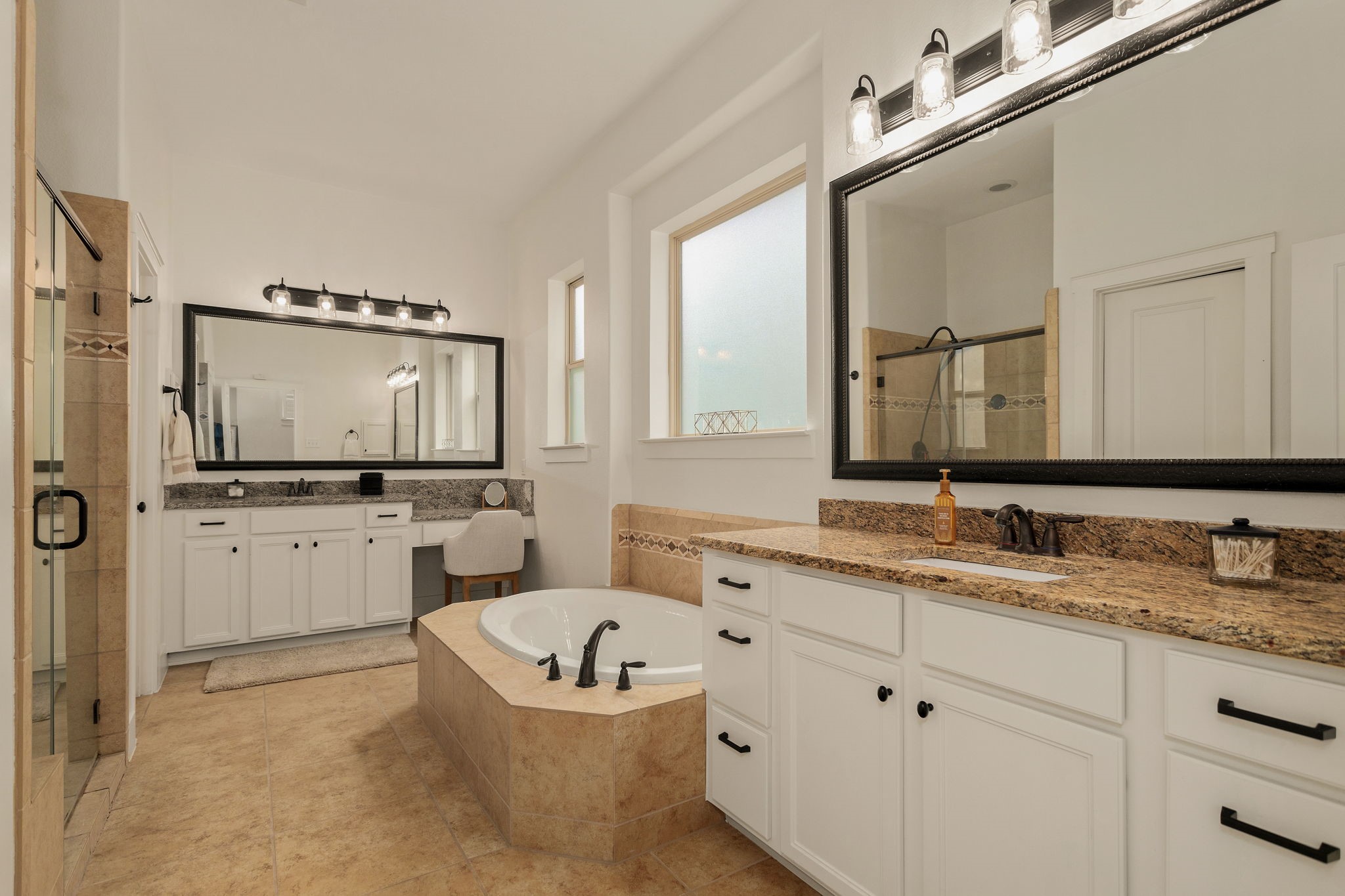 16650 Seminole Ridge Drive Cypress, TX 77433 - Photo 15 of 27 a bathroom with a granite countertop sink mirror and bathtub