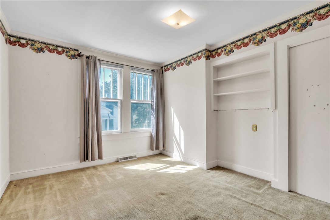 121 Ellison Street Belton, SC 29627 - Photo 15 of 30 This bright room features natural light and built-in shelving, perfect for a personalized touch.