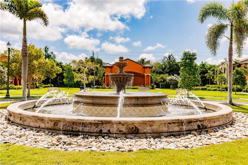9081 Albion Lane South, Unit 6502 Naples, FL 34113 - Photo 14 of 37 a view of a swimming pool with a yard