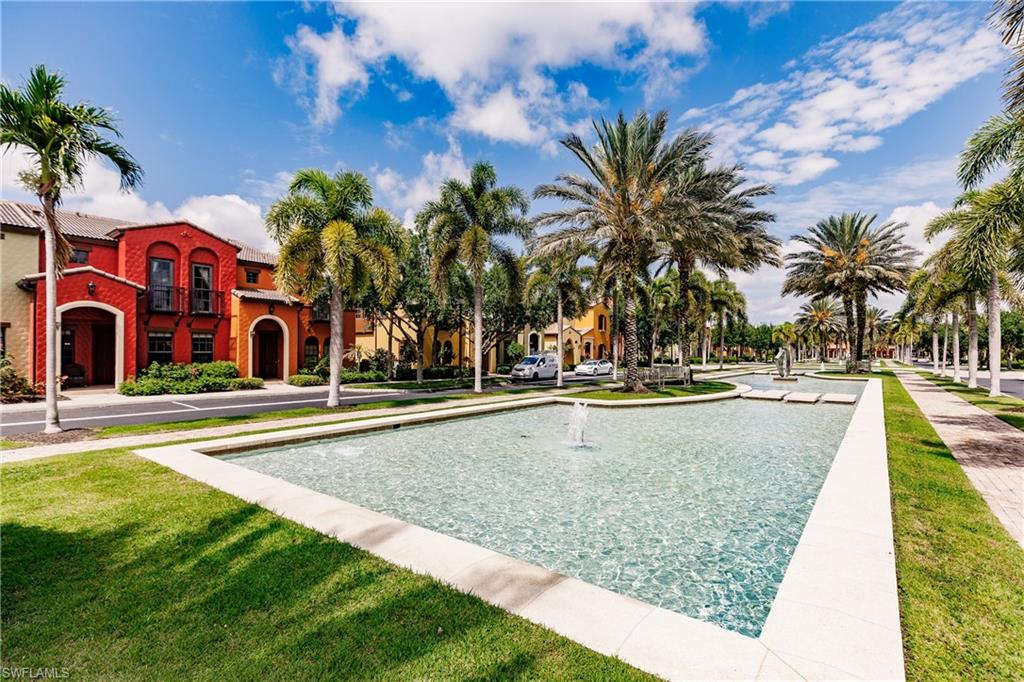 9081 Albion Lane South, Unit 6502 Naples, FL 34113 - Photo 16 of 37 a view of swimming pool with palm trees