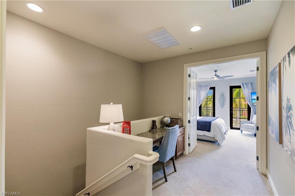 9081 Albion Lane South, Unit 6502 Naples, FL 34113 - Photo 25 of 37 a living room with furniture and a window