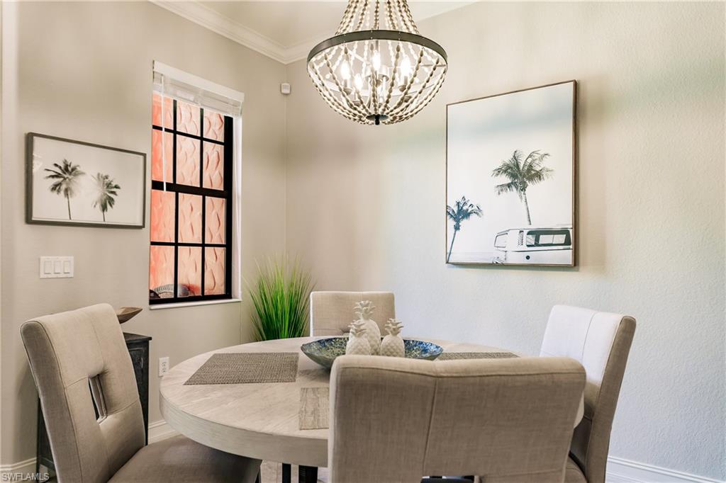 9081 Albion Lane South, Unit 6502 Naples, FL 34113 - Photo 29 of 37 a dining room with furniture and window