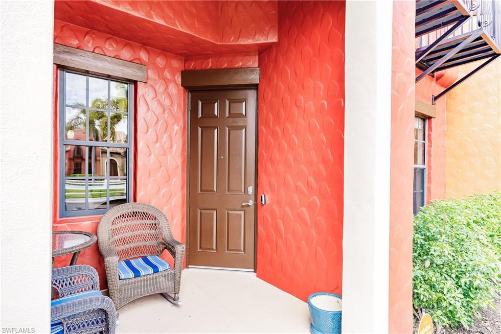 9081 Albion Lane South, Unit 6502 Naples, FL 34113 - Photo 33 of 37 a bedroom with furniture and a window