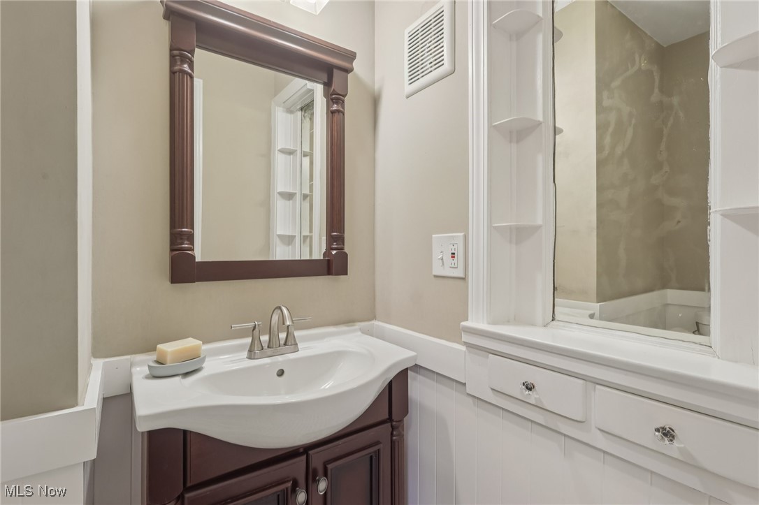 17024 Fernway Road Cleveland, OH 44120 - Photo 21 of 46 Half Bathroom featuring vanity on main floor