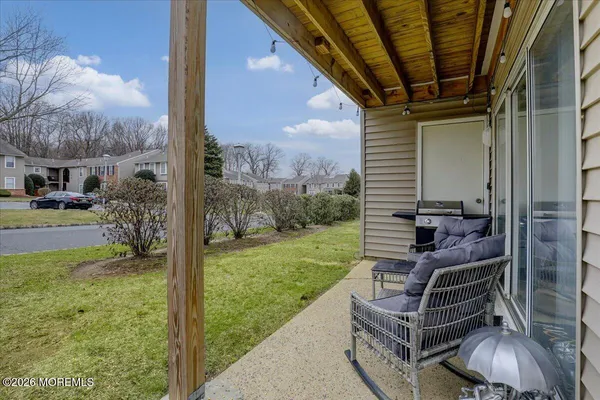 a view of a two chairs in the patio