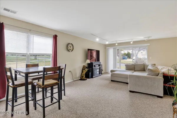 a living room with furniture and a table