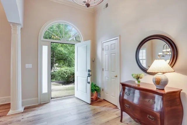 a bedroom with a bed dresser and a window