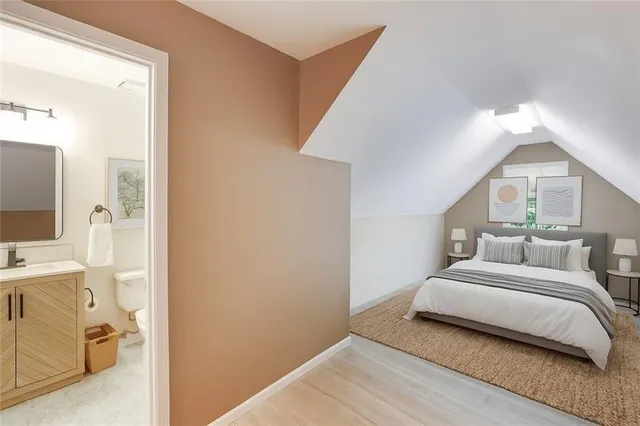 a bedroom with a bed and a view of bathroom