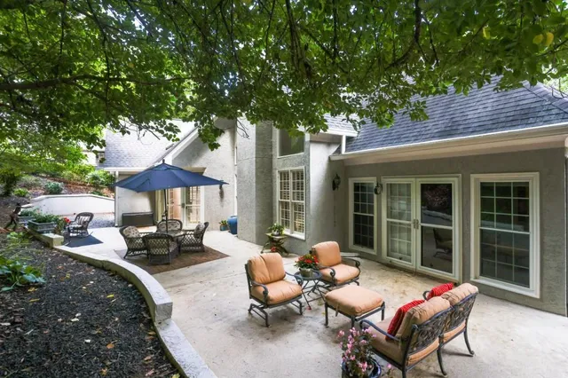 a view of a patio with furniture