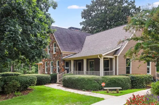 a view of a house with a yard balcony