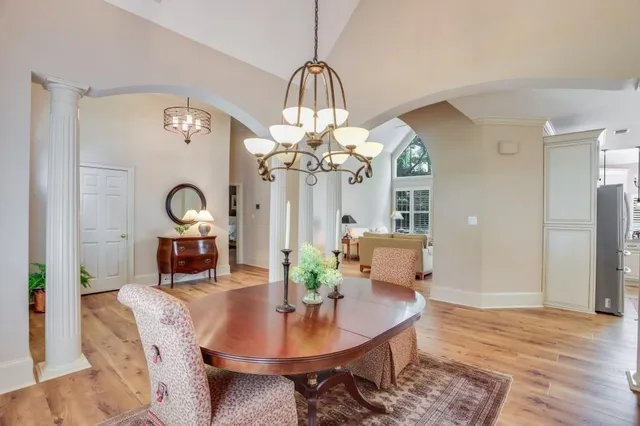 a bathroom with a granite countertop sink toilet and mirror