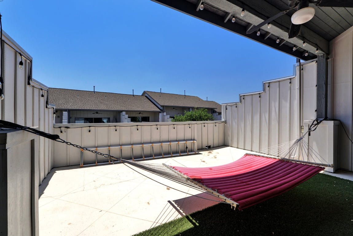 2520 Bluebonnet Lane, Unit 41 Austin, TX 78704 - Photo 28 of 30 a view of a backyard with a table and chair