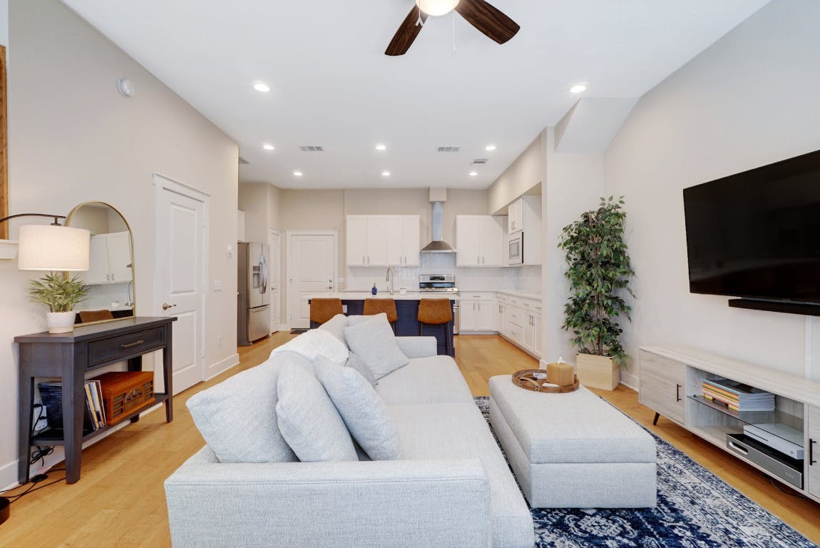 2520 Bluebonnet Lane, Unit 41 Austin, TX 78704 - Photo 8 of 30 a living room with furniture and a flat screen tv