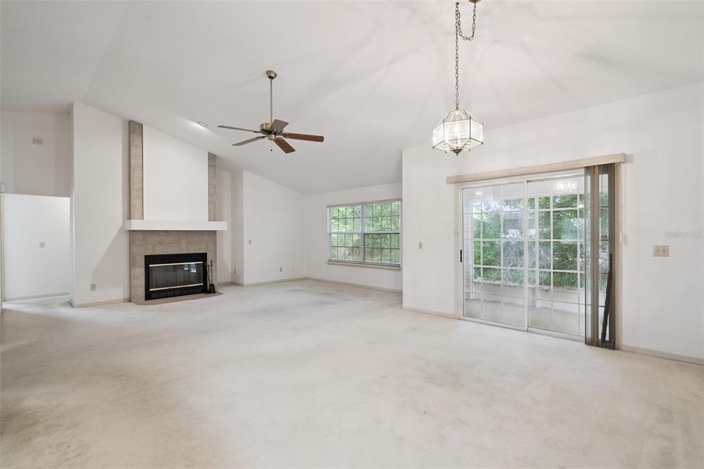 1193 Glen Falls Road DeLand, FL 32720 - Photo 4 of 20 a view of an empty room with a fireplace