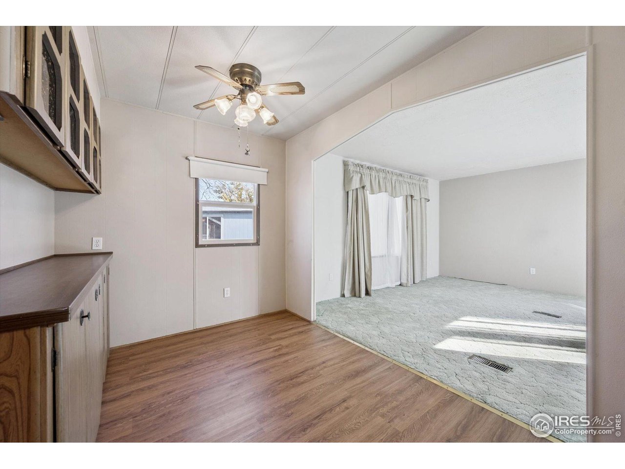 11990 East South Boulder Road, Unit 143 Lafayette, CO 80026 - Photo 11 of 19 a view of an empty room with wooden floor