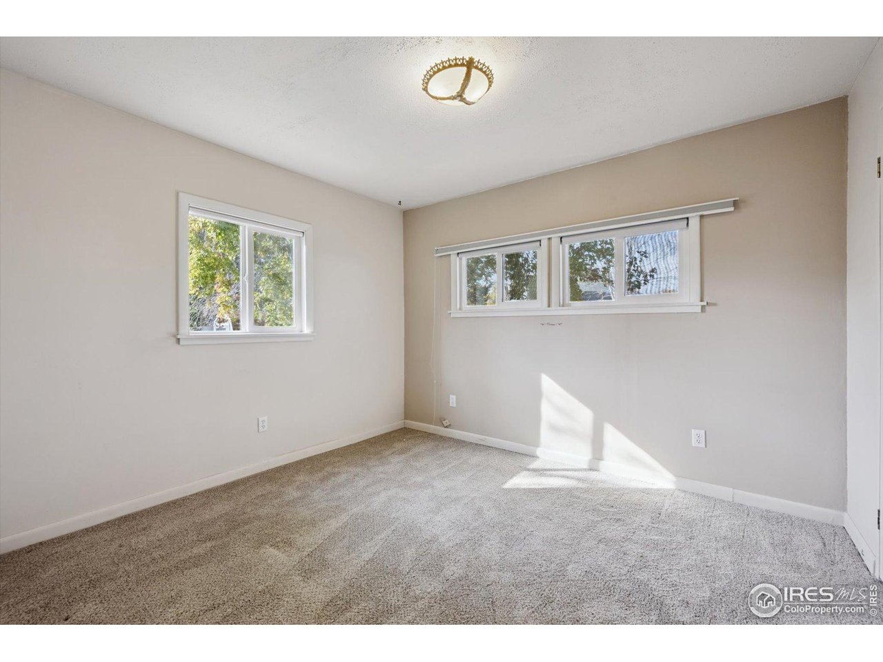 11990 East South Boulder Road, Unit 143 Lafayette, CO 80026 - Photo 16 of 19 a view of an empty room with a window