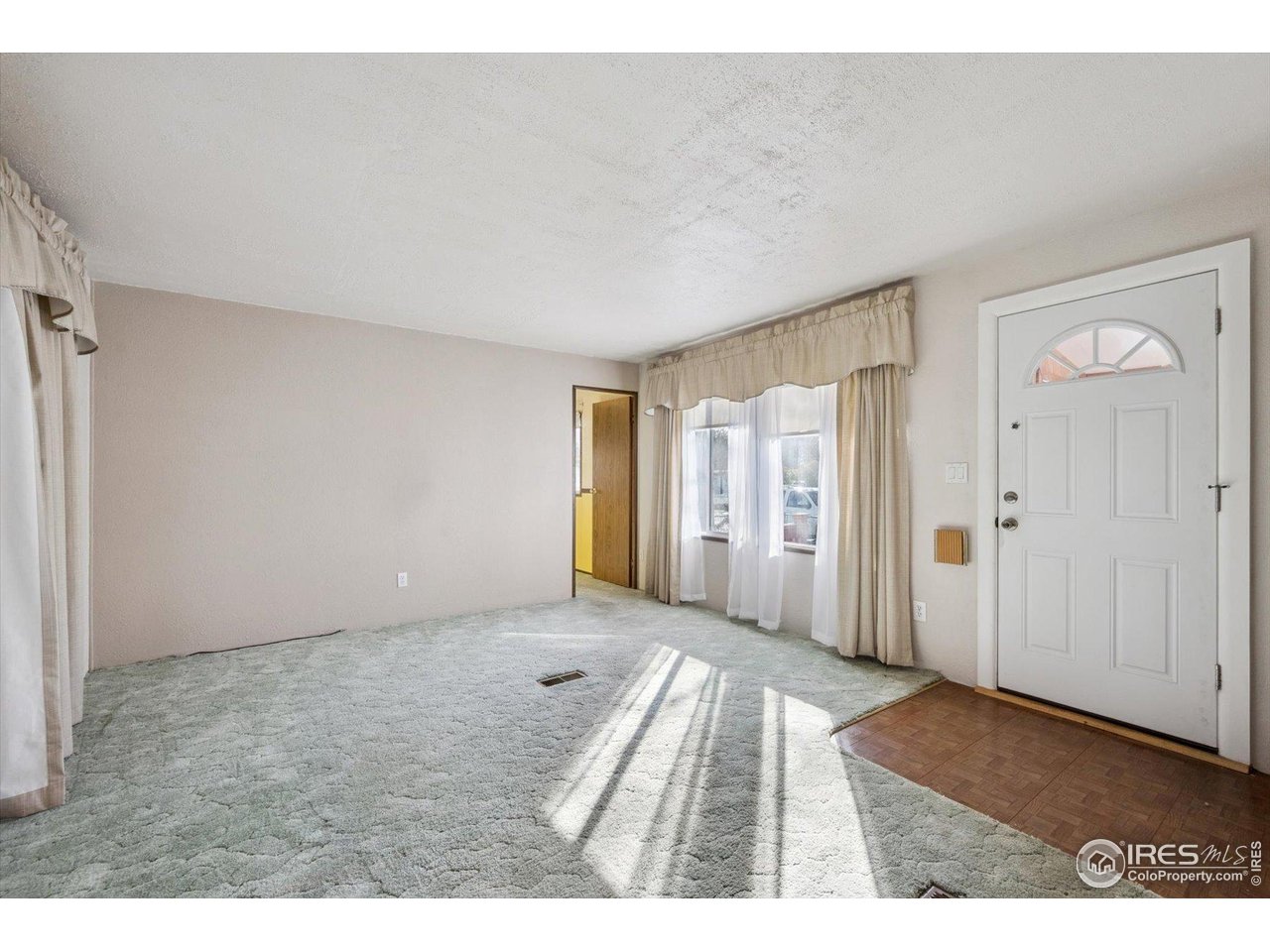 11990 East South Boulder Road, Unit 143 Lafayette, CO 80026 - Photo 5 of 19 a view of an empty room and window